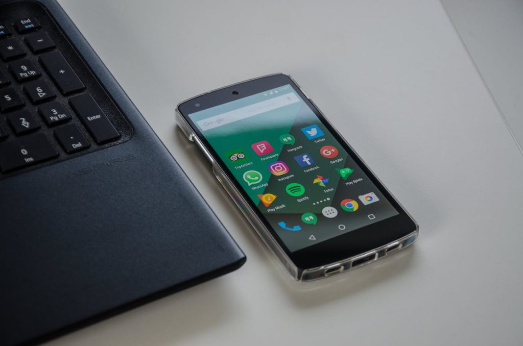 Black Android Smartphone Near Laptop
